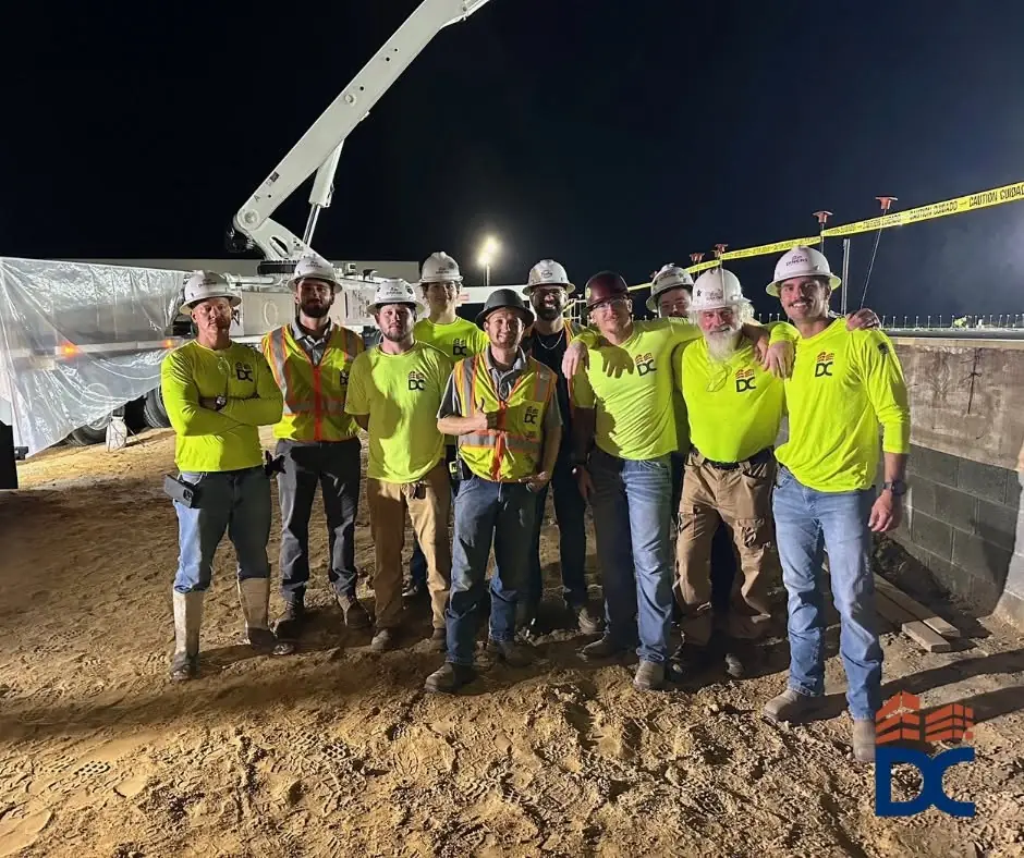Dinkins field crew in high-visibility gear on a night pour
